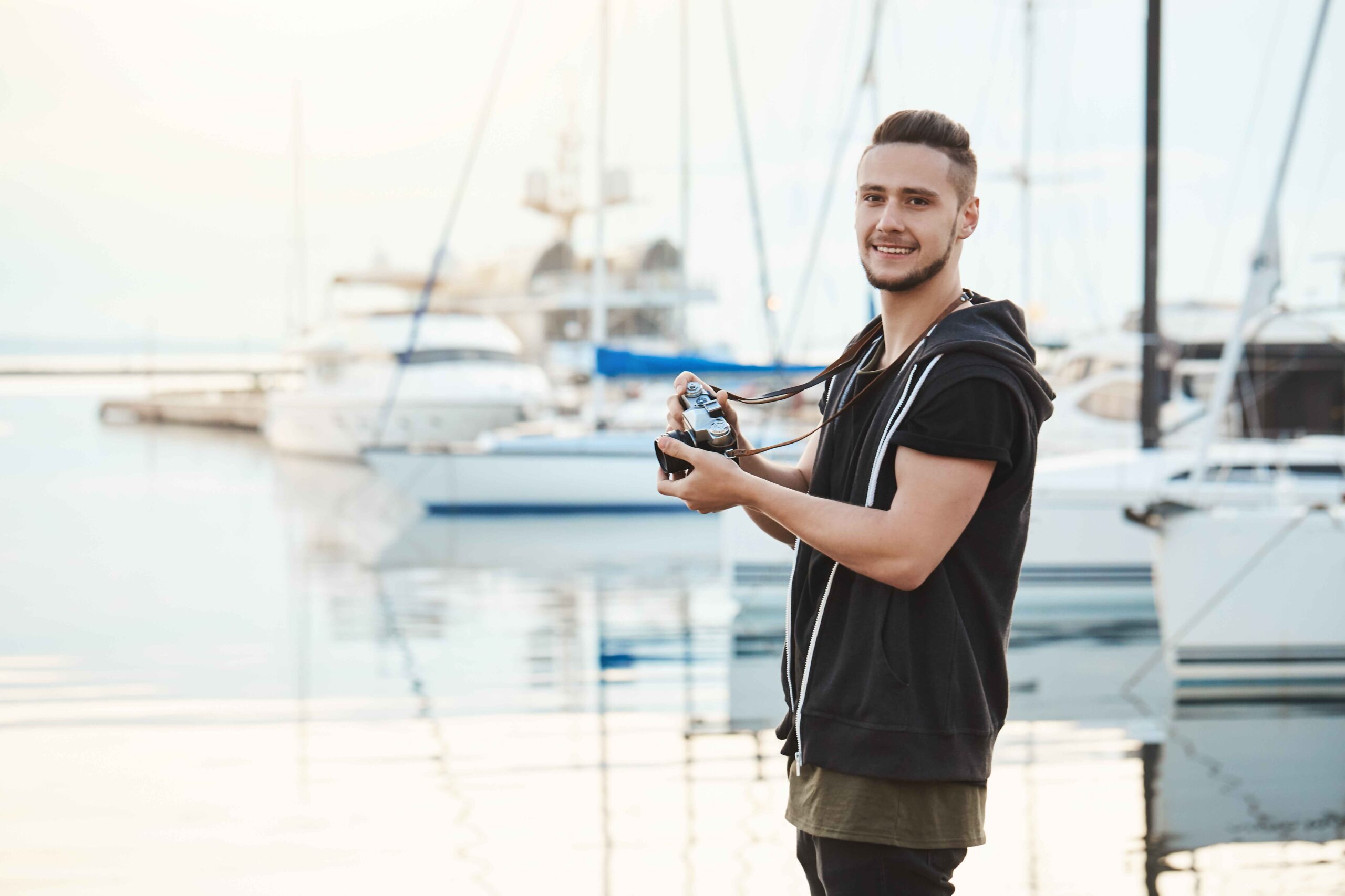 Picture of a man doing yacht photography in dubai at marina