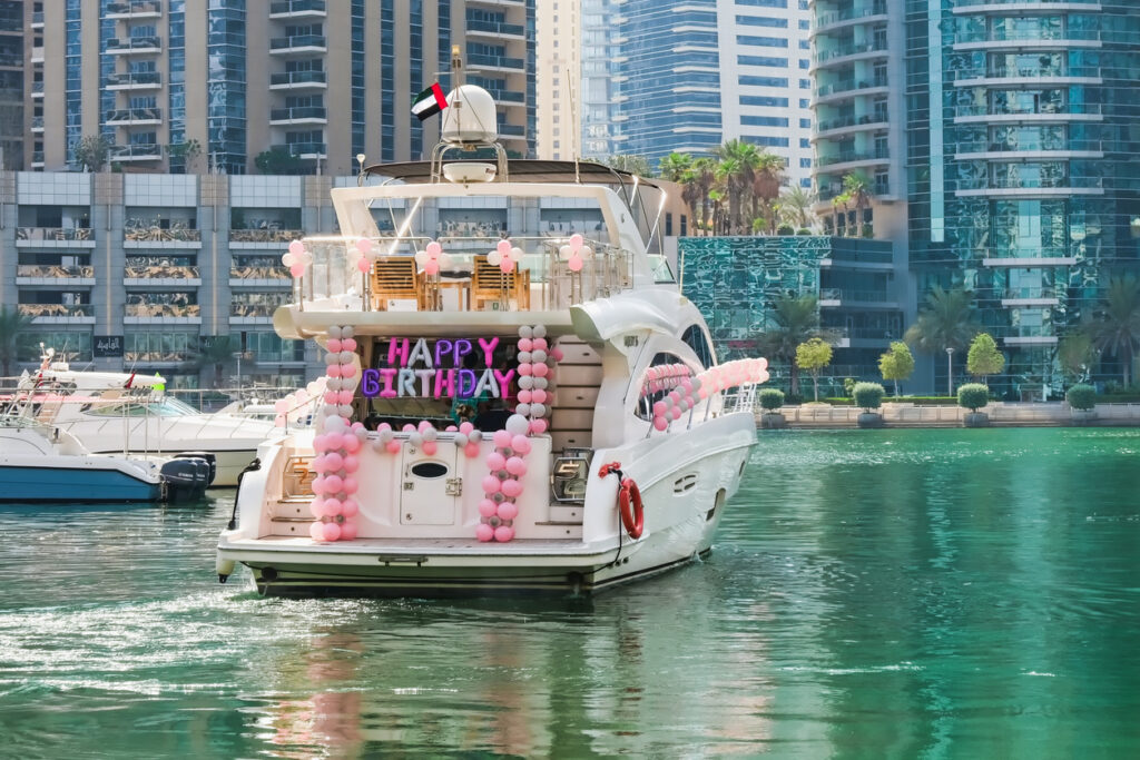 Image of a yacht with people celebrating Birthday party in dubai