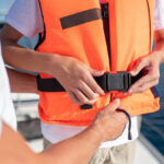 Image of a boy getting ready for a safe yacht trip in Dubai.
